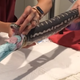 Image for article titled This beach towel getting pulled out of a snake is the worst magic trick we've ever seen